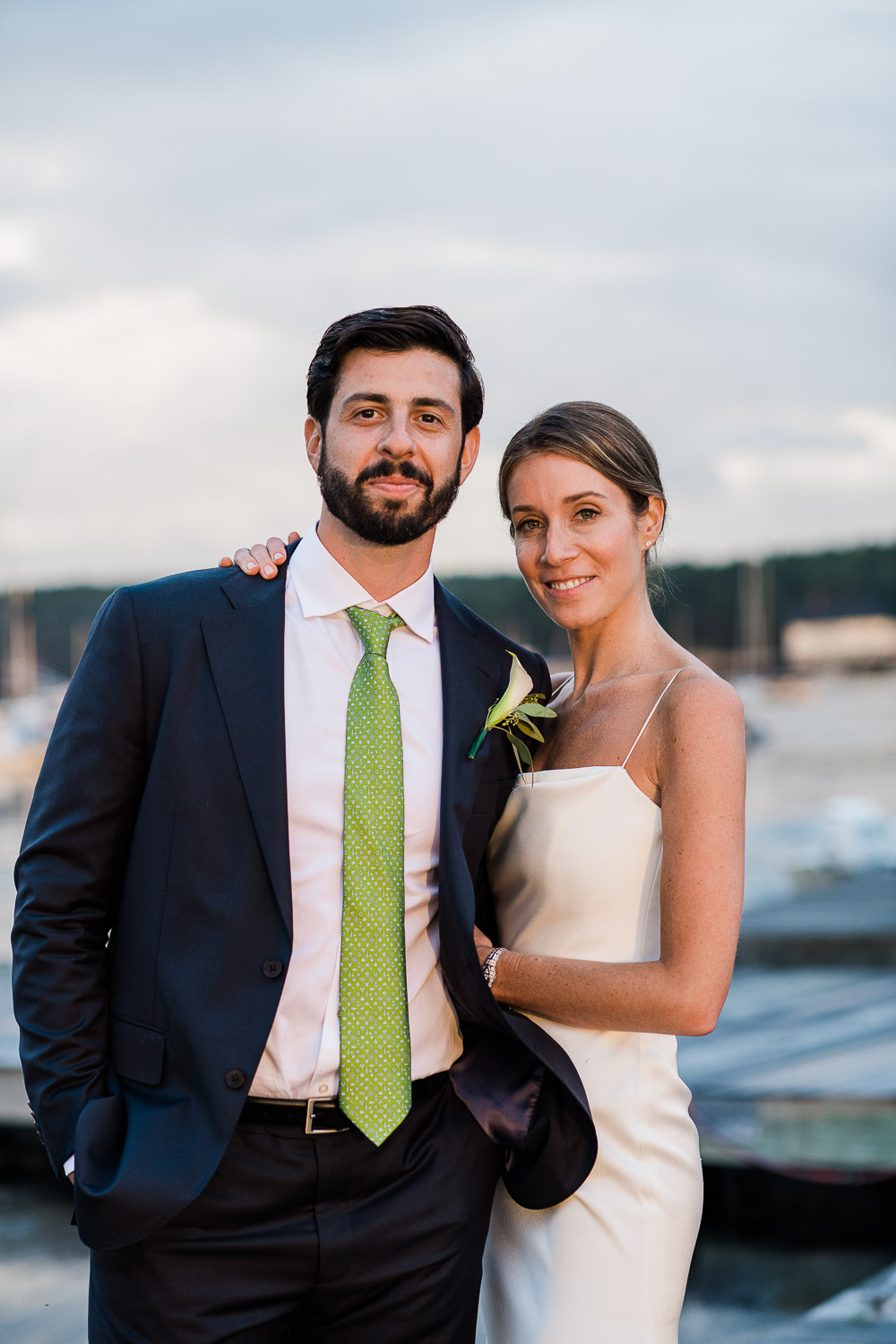 bride and groom formal on dock by water at the Annisquam Yacht Club