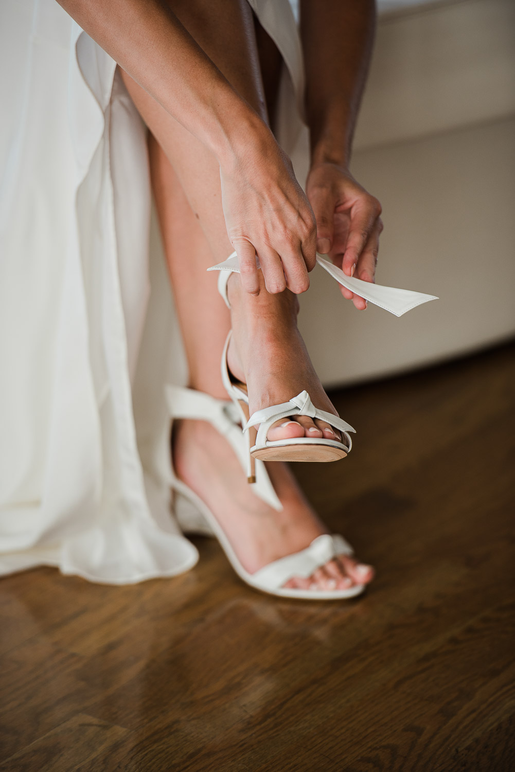 bride putting on shoes at Belle Mer in Newport RI
