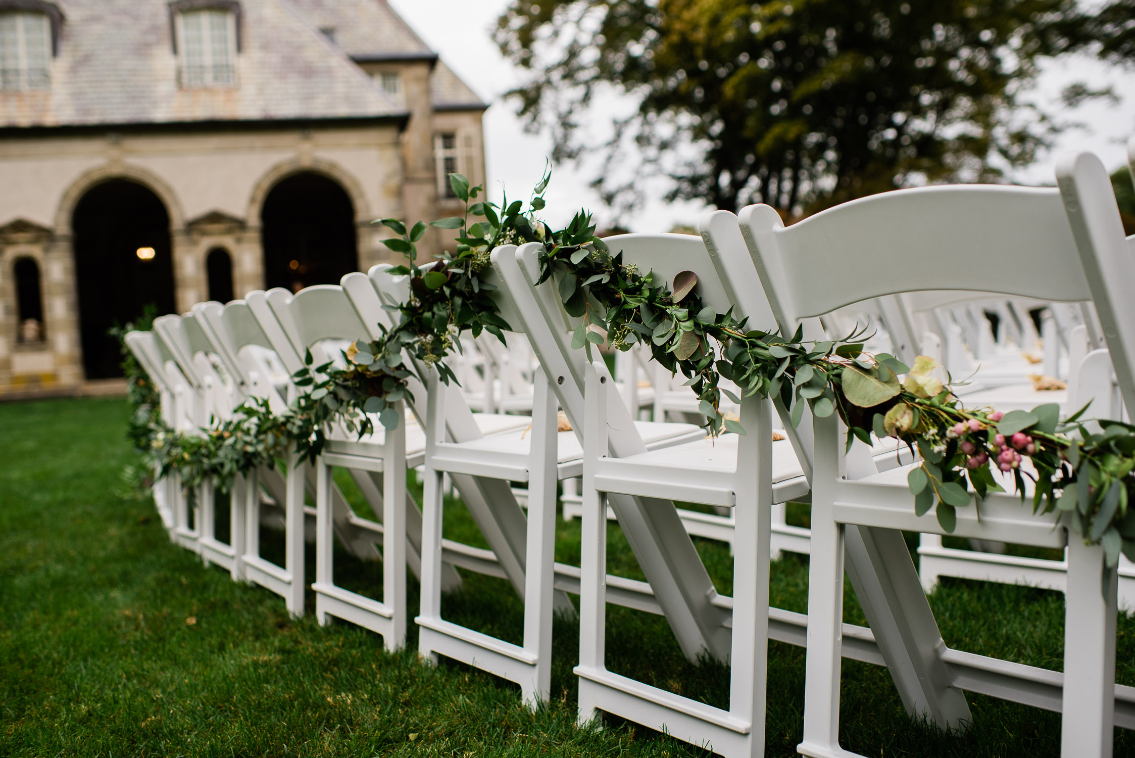 wedding ceremony chairs draped with garland at the Glen Manor House
