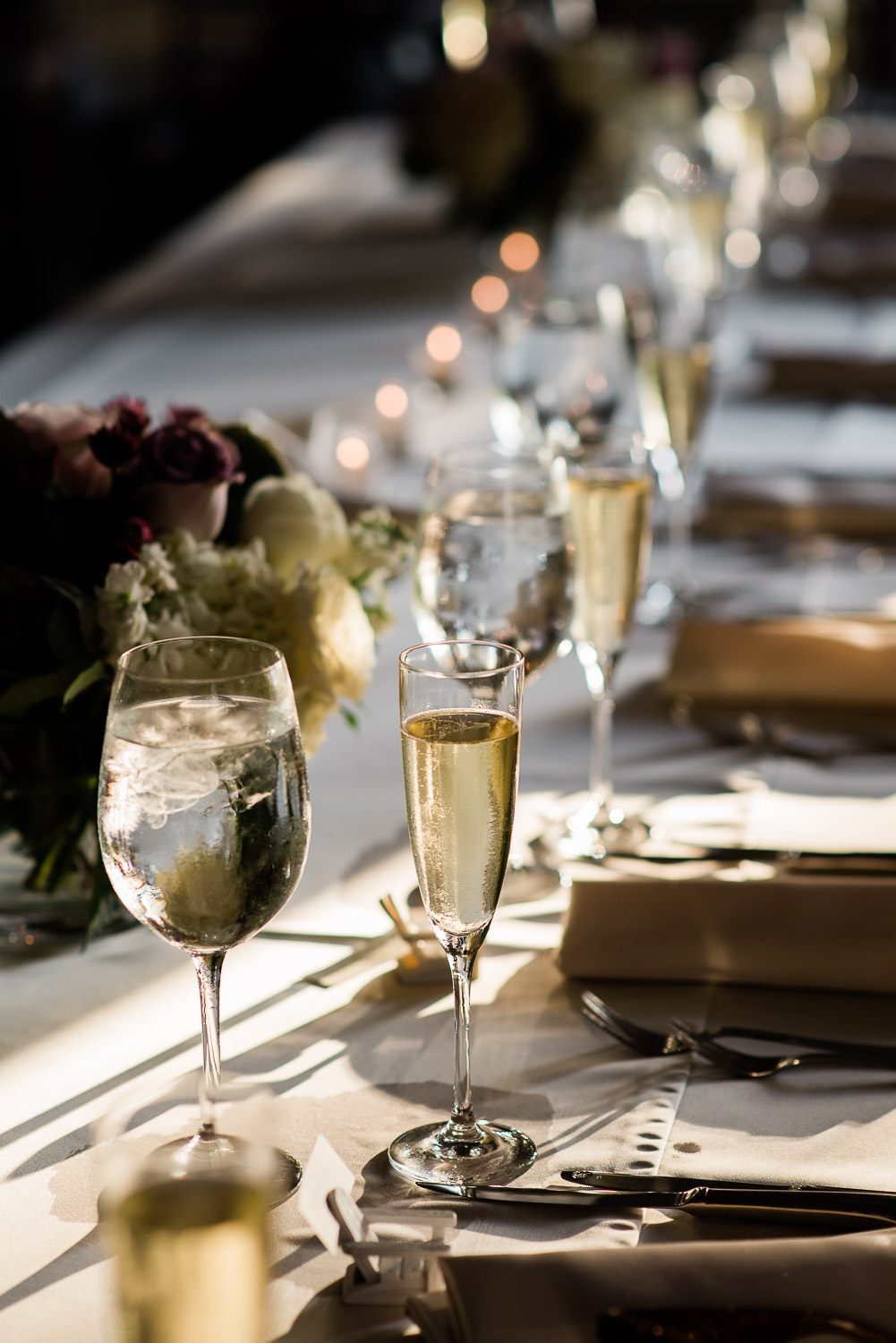 tablescape of champagne glasses in the sunlight at Blithewold Mansion