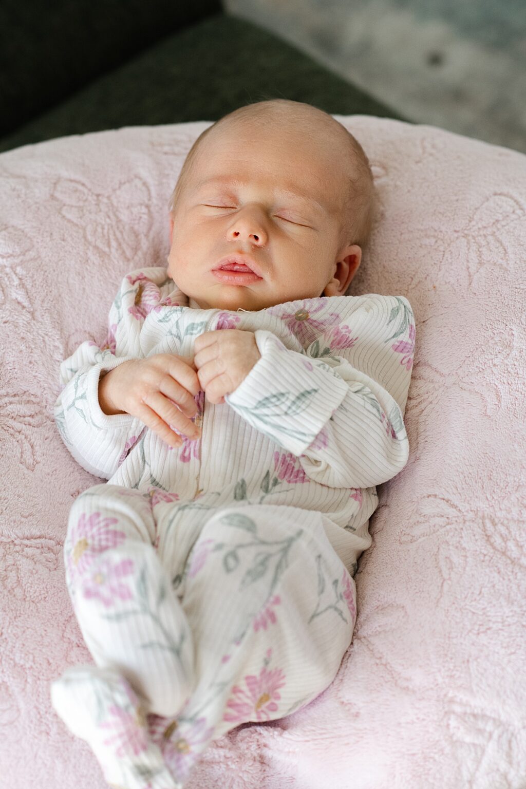 portrait of newborn baby on pink blanket