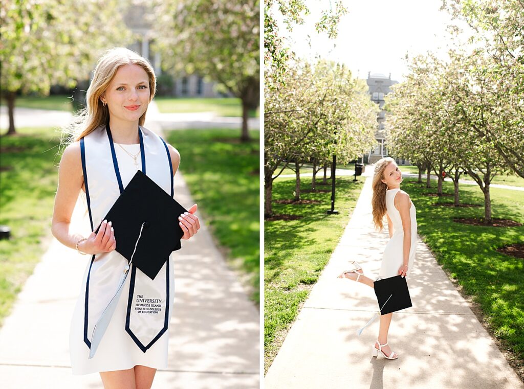 female grad holding cap and wearing university sash in front of blossoming trees