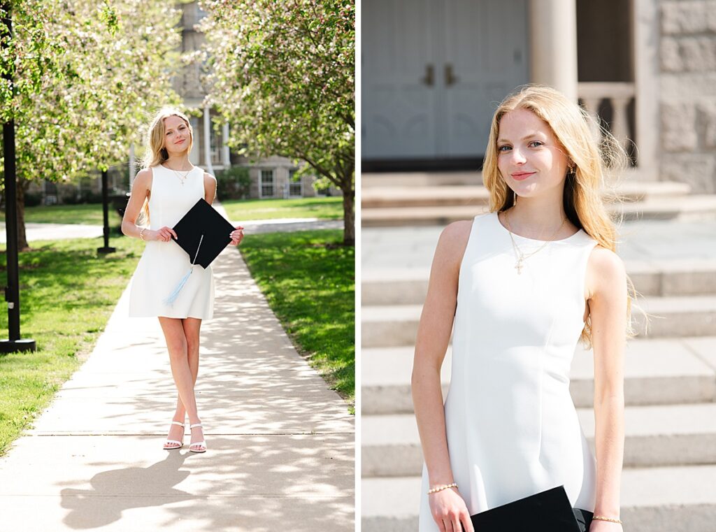college grad holding cap in between row of trees on the University of Rhode Island campus