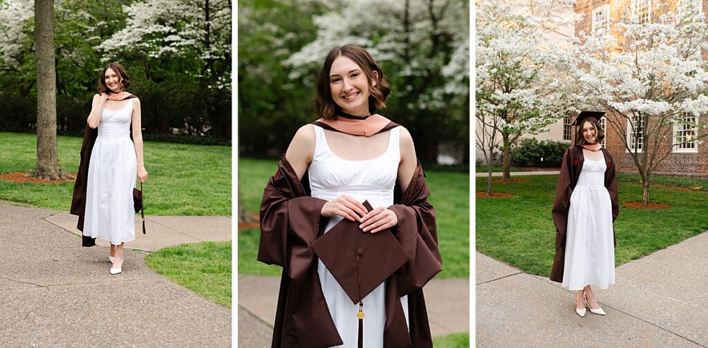 Graduate smiling beneath blooming spring trees